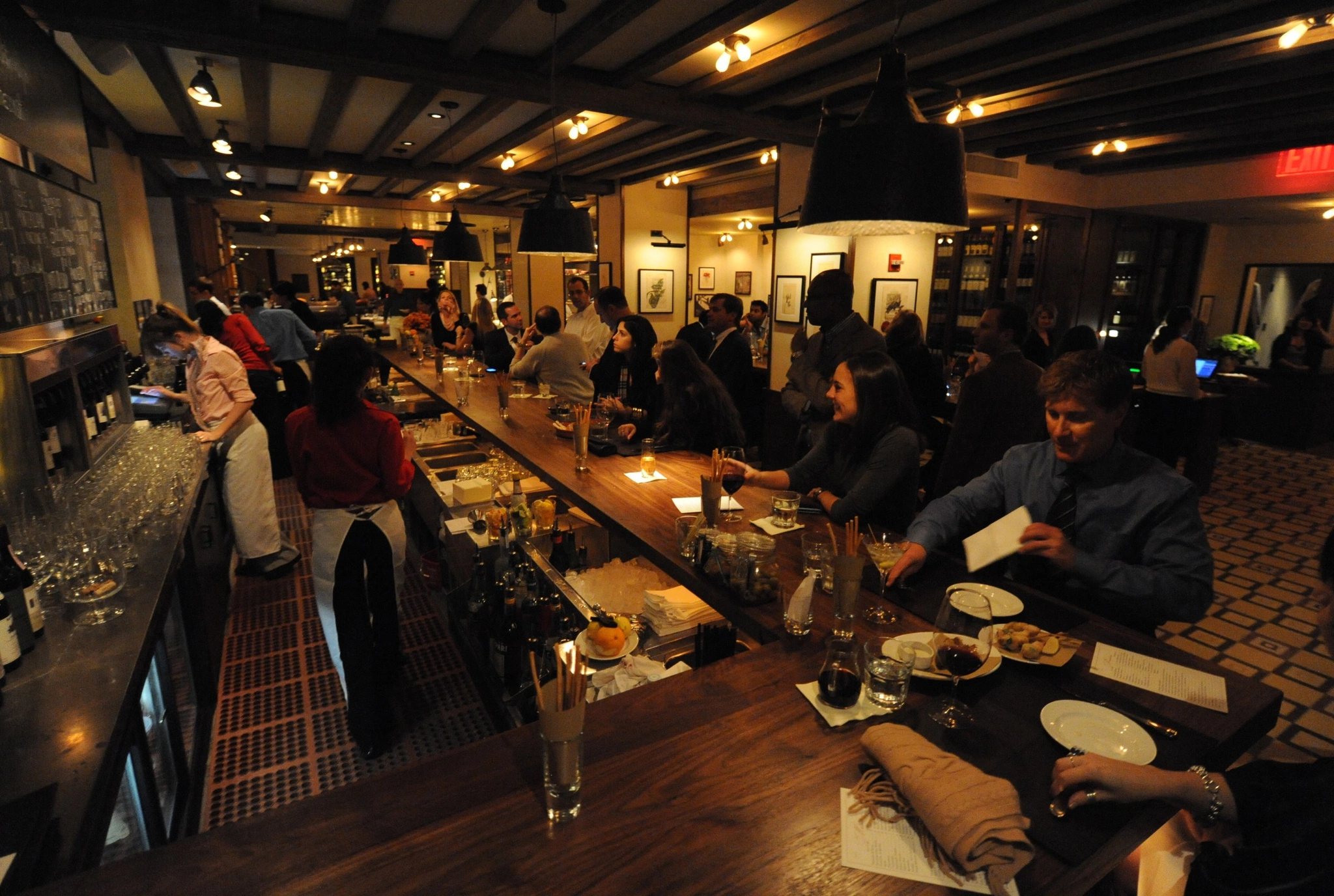 A full dining room and bar mid-service